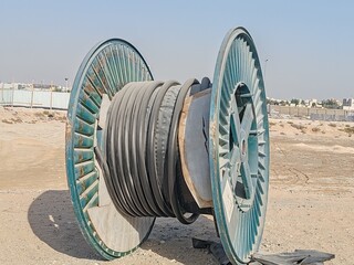 Cable or Electric Wire Wodden Round bundle for power installation.
Cable reels stacked at...