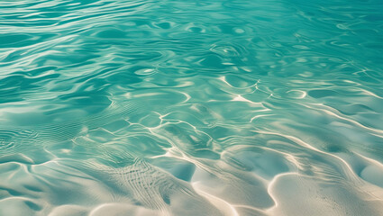 Shallow turquoise water with soft ripples over sandy bottom, evoking a clean, tropical feel. Perfect for spa visuals or summer backgrounds.


