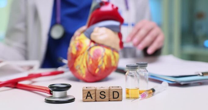 A visual representation of Autism Spectrum Disorder ASD with medical tools and a heart model illustrating anatomy