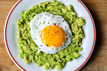 Healthy Fried Egg On Mashed Avocado Meal