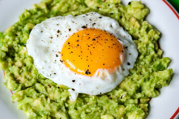 Healthy Fried Egg On Mashed Avocado Meal