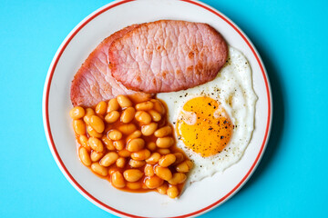 Fried Egg With Pork Bacon Rashers And Baked Beans In Tomato Sauce