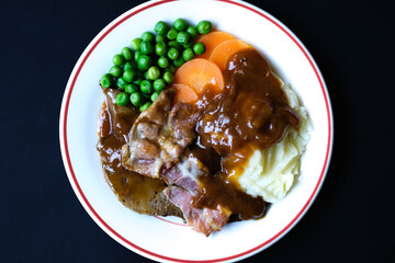 Classic Liver and Bacon With Mash Potatoes Peas Carrots and Onion Gravy