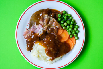 Classic Liver and Bacon With Mash Potatoes Peas Carrots and Onion Gravy