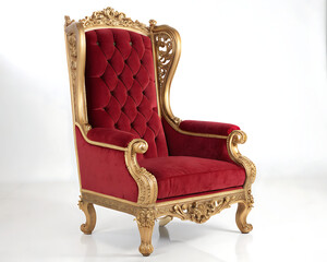 A luxurious red velvet armchair with ornate gold trim sitting on a white surface in a studio setting