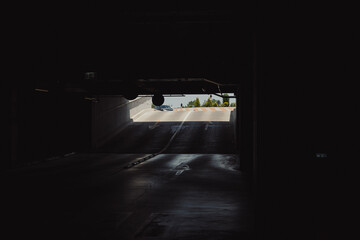Empty parking lot with overhead dim light