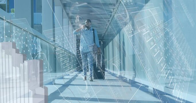 Traveler walking glass skybridge while answering phone as animated analytics charts appear over him