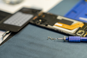 Expert Phone Repair Process Showcasing Disassembled Smartphone Components and Precision Tools in a...