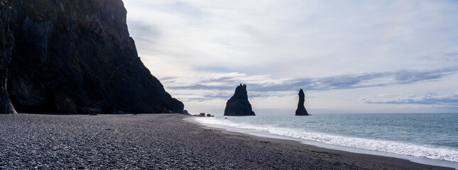 Breathtaking views of Reynisfjara Beach with unique basalt columns and dramatic sea stacks