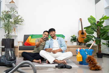 LGBTQIA Friendship and Connection. Two young men taking a selfie while enjoying their time at home.