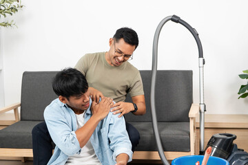 Affectionate LGBTQIA Couple Relaxing Together at Home