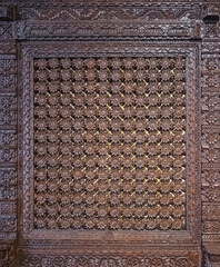 Intricately carved wood panel with floral and geometric patterns, Ancient window texture