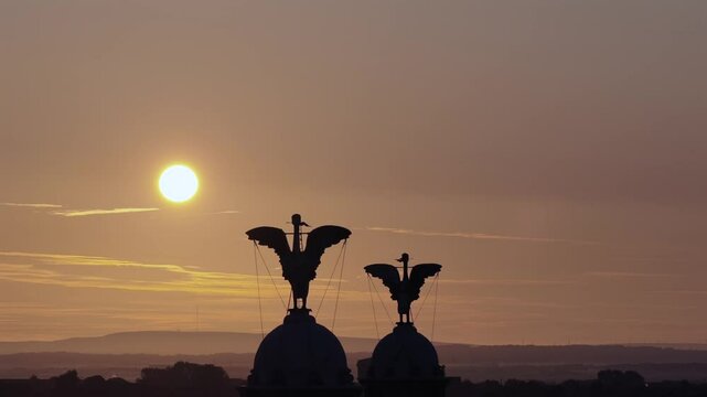 Sun rising over the towers of Liver building in Liverpool UK 