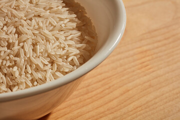 a bowl of uncooked, white, basmati rice