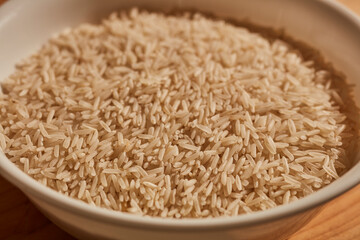 a bowl of uncooked, white, basmati rice