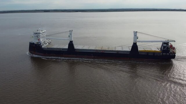 Drone 50fps. An empty cargo, container transporting on a river. 