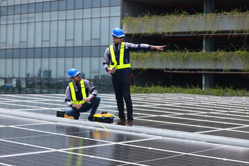 Professional engineer team check new solar roof project , green and renewable energy supply for...