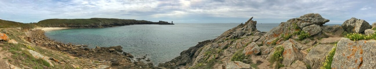 Panoramic view of coastal cliffs with rocky shores and a tranquil bay