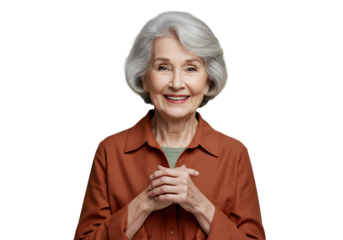Graceful Elderly Caucasian Woman Smiling Warmly with Hands Clasped in Front Isolated on PNG Background.