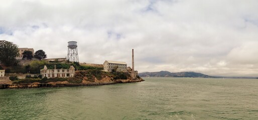 Panorama of a historic coastal building under a cloudy sky