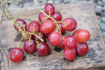 Fresh red grapes on bamboo container