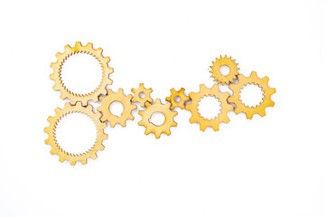 Wooden cogwheels on white background	
