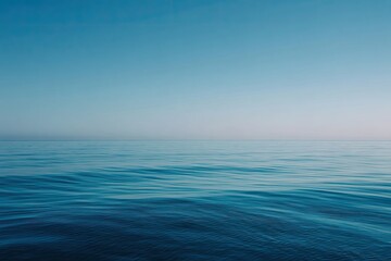 Obraz premium Tranquil ocean expanse under a vast, clear sky