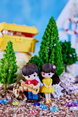 doll guitar performance of a song about the treasures of summer love of a boy for a girl on the seashore, the concept of the beginning of a relationship and the charm of youth