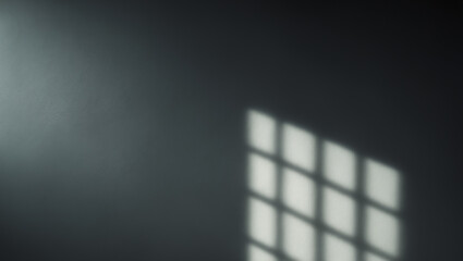 Minimalistic blurred shadow on black wall in dark room