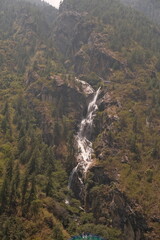 Waterfall Surrounded by Trees in the Nepalese Himalayas