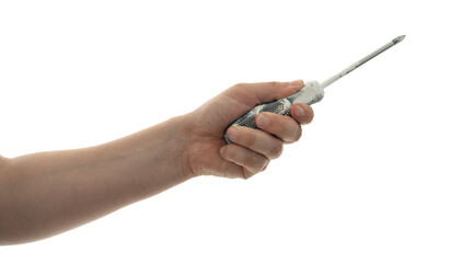 Hand holding a screwdriver ready for assembly or repair task in a workspace