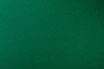 Fototapeta premium Dark green paper background texture.