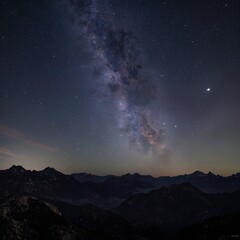Fototapeta premium Starry Milky Way over majestic mountains in a cinematic deep space scene with clean noise reduced black tones