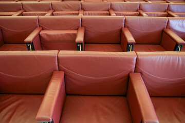 conference room with row of red leather armchairs