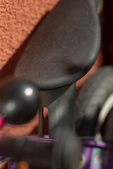 This image features a closeup view of a notable black object placed prominently in the foreground,...