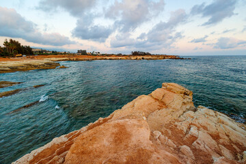 Eroded Coastal Cliffs by the Mediterranean Sea, Golden coastal rock formations shaped by erosion,...