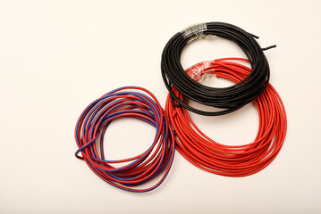 Bundles of copper connecting wires in rubber insulation. Multicolored wires.