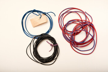 Bundles of copper connecting wires in rubber insulation. Multicolored wires.