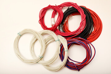 Bundles of copper connecting wires in rubber insulation. Multicolored wires.
