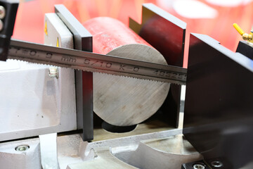 A hacksaw for metal cutting is presented to the general public at a machine and tool fair.