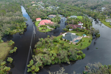 Heavy flood with high water surrounding residential houses after hurricane rainfall in Florida...