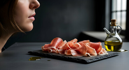 Elegant Still Life Featuring Prosciutto Slices And Olive Oil Decanter