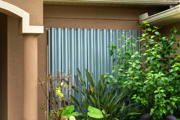 Hurricane shutters made from steel mounted for protection of house windows. Protective measures...
