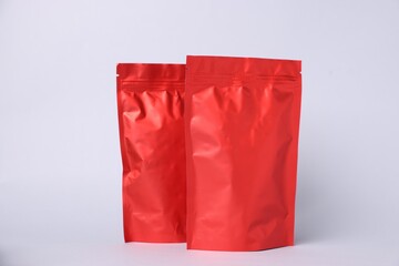 Zipper stand-up pouches on light grey background. Mockup for design