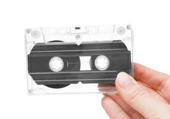 Woman with audio cassette on white background, closeup