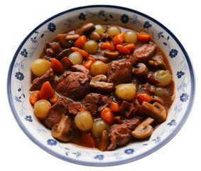 Coq au Vin. Typical, French dish of chicken in a red Burgundy wine sauce with mushrooms, carrots and pearl onions or shallots. 