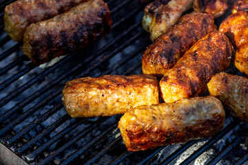 Pork chops, steak, sausages on barbecue grill