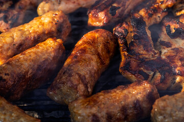Pork chops, steak, sausages on barbecue grill