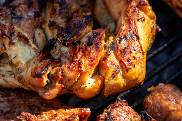 Pork chops, steak, sausages on barbecue grill