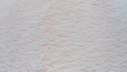 Aerial view of a pink salt lake bottom on a beautiful summer evening.